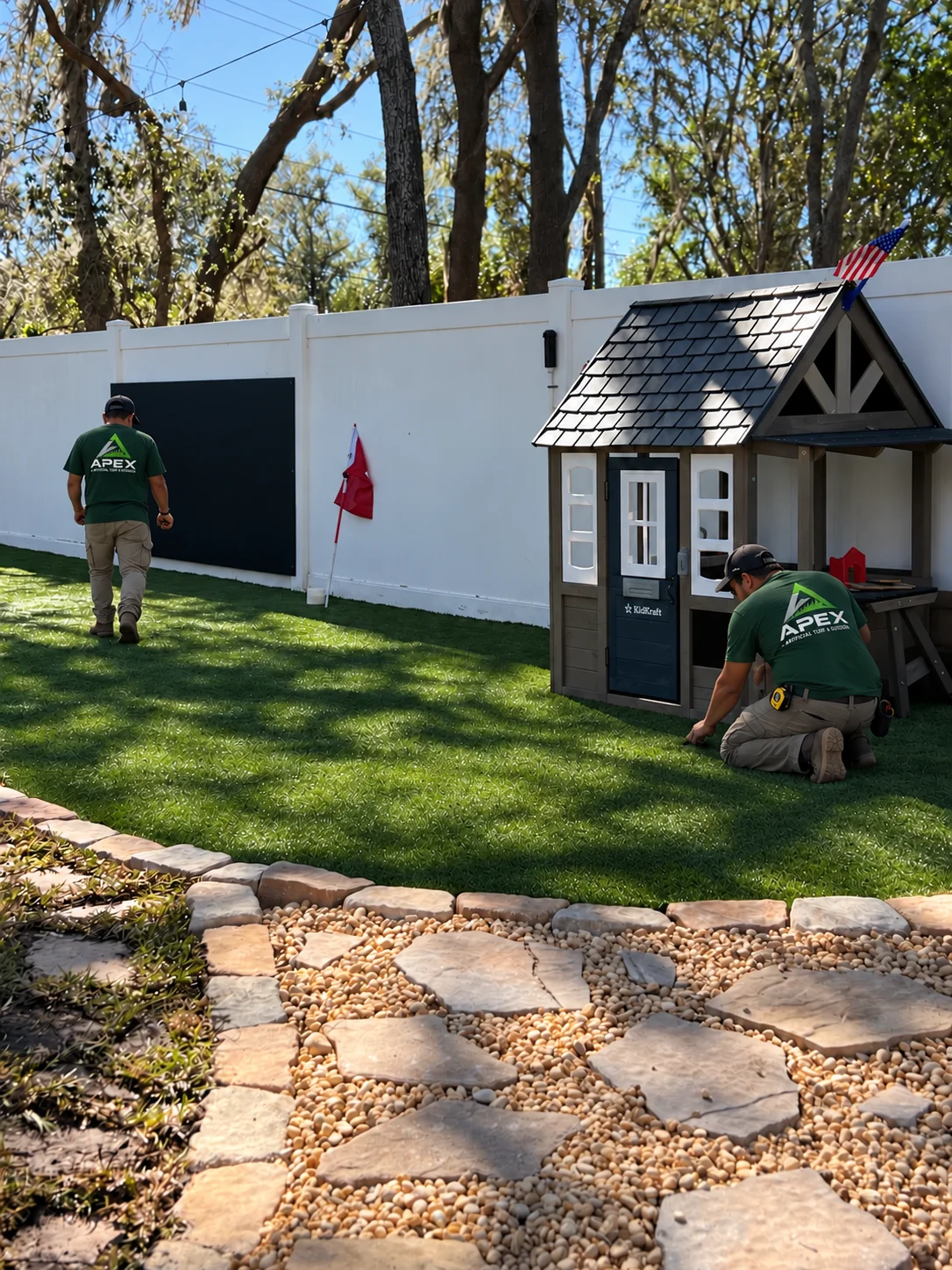 Finished turf play area with playhouse and putting target
