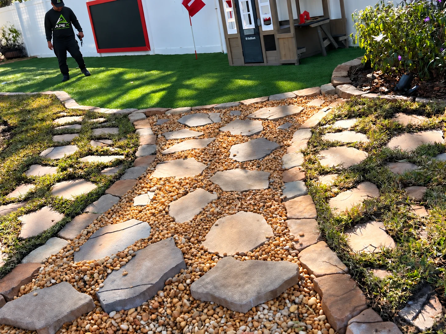 Closer view of the stone path and turf around the play area