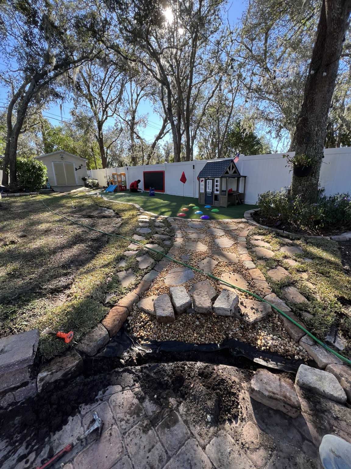 Wide view of finished path, turf and play area
