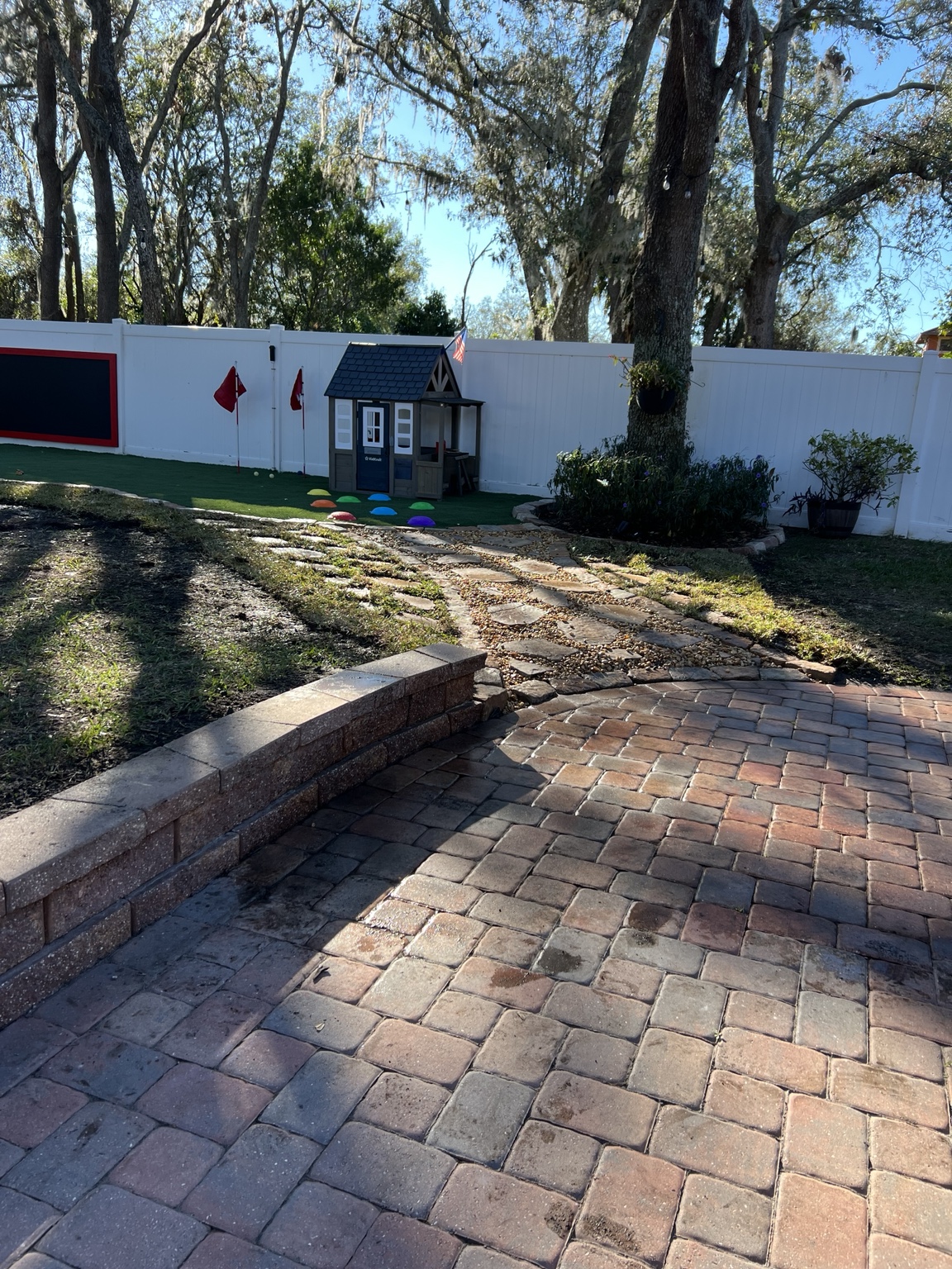 Completed backyard turf and stone transition from the patio