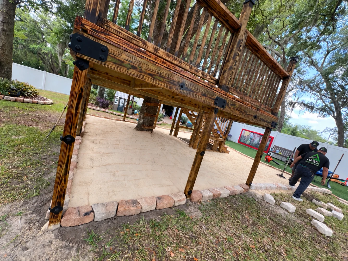 Site preparation around a wooden backyard structure